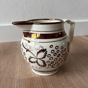 White and Gold pitcher with a shinny finish